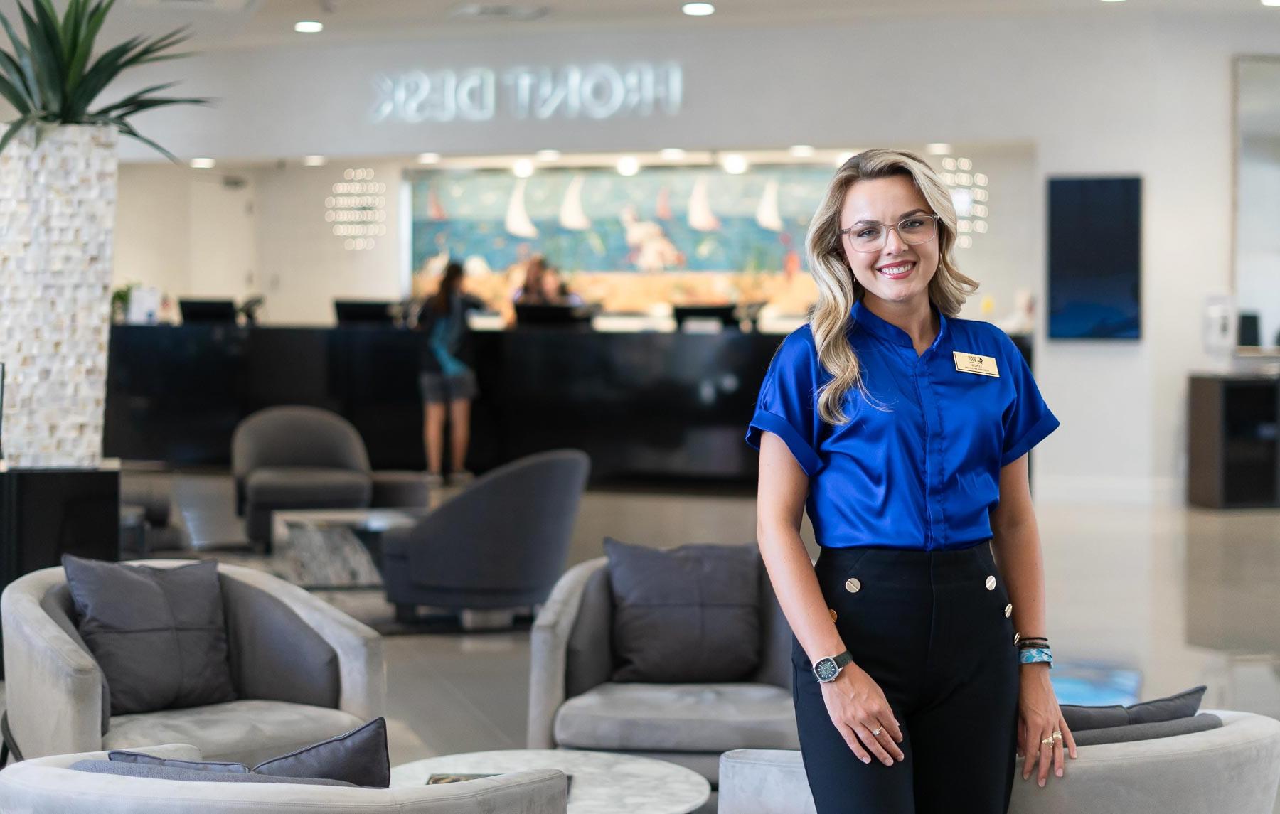 Lenzie Richardson, who graduated in hospitality and tourism management from the University of South Alabama, at the Perdido Beach Resort near the front desk, where she is an assistant manager.